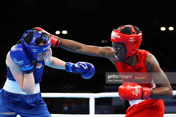 Ghana's Ornella Sathoud delivers a right jab at Kerry Davis of Team England in their clash on Friday